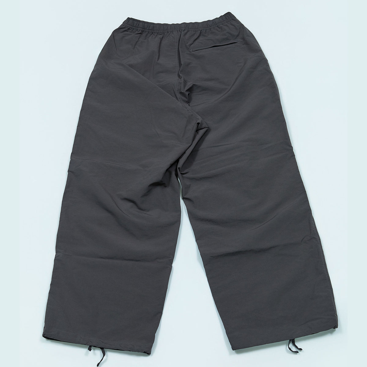 NYLON TRACK TROUSERS “MINDFULNESS SWIMMING” ー GRY