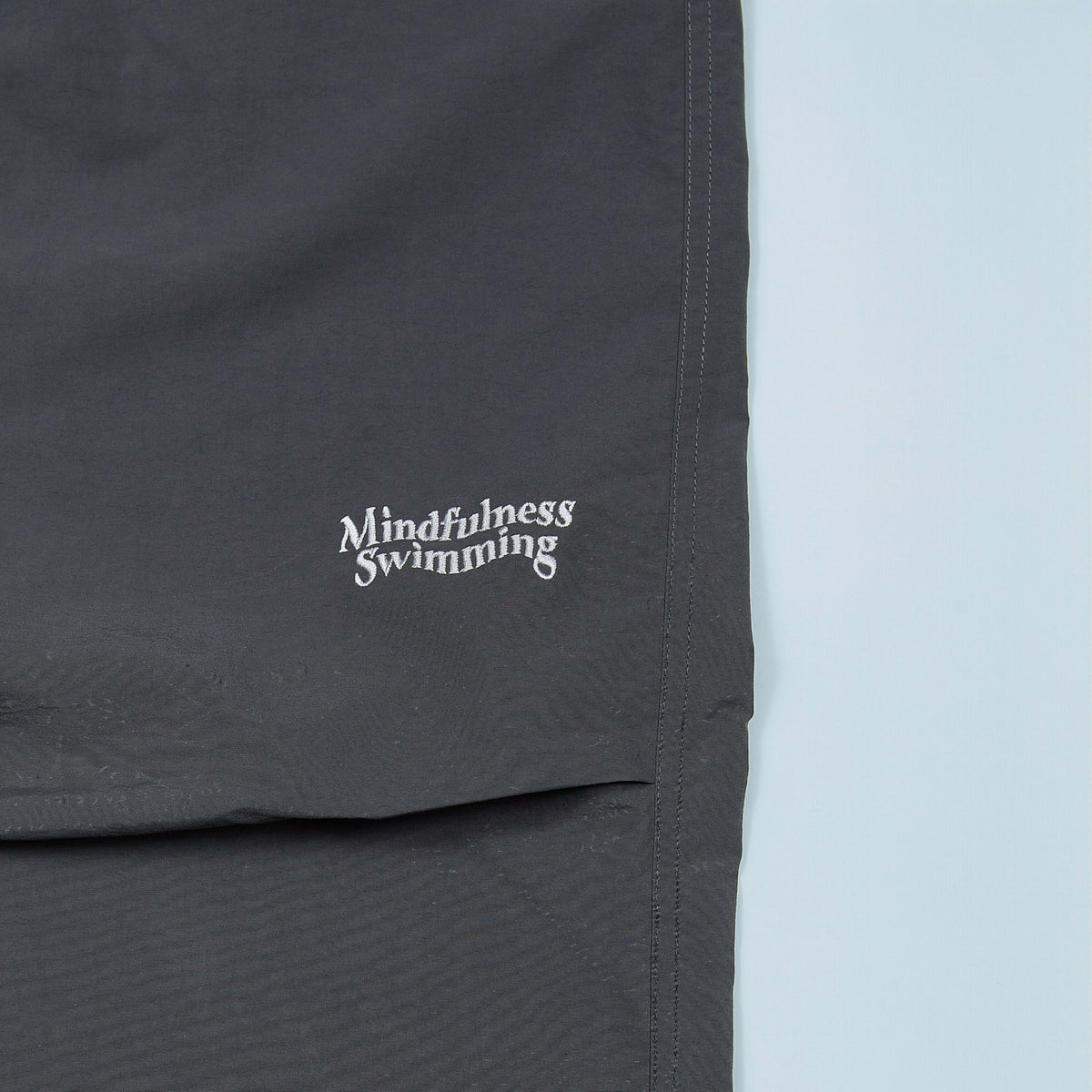NYLON TRACK TROUSERS “MINDFULNESS SWIMMING” ー GRY