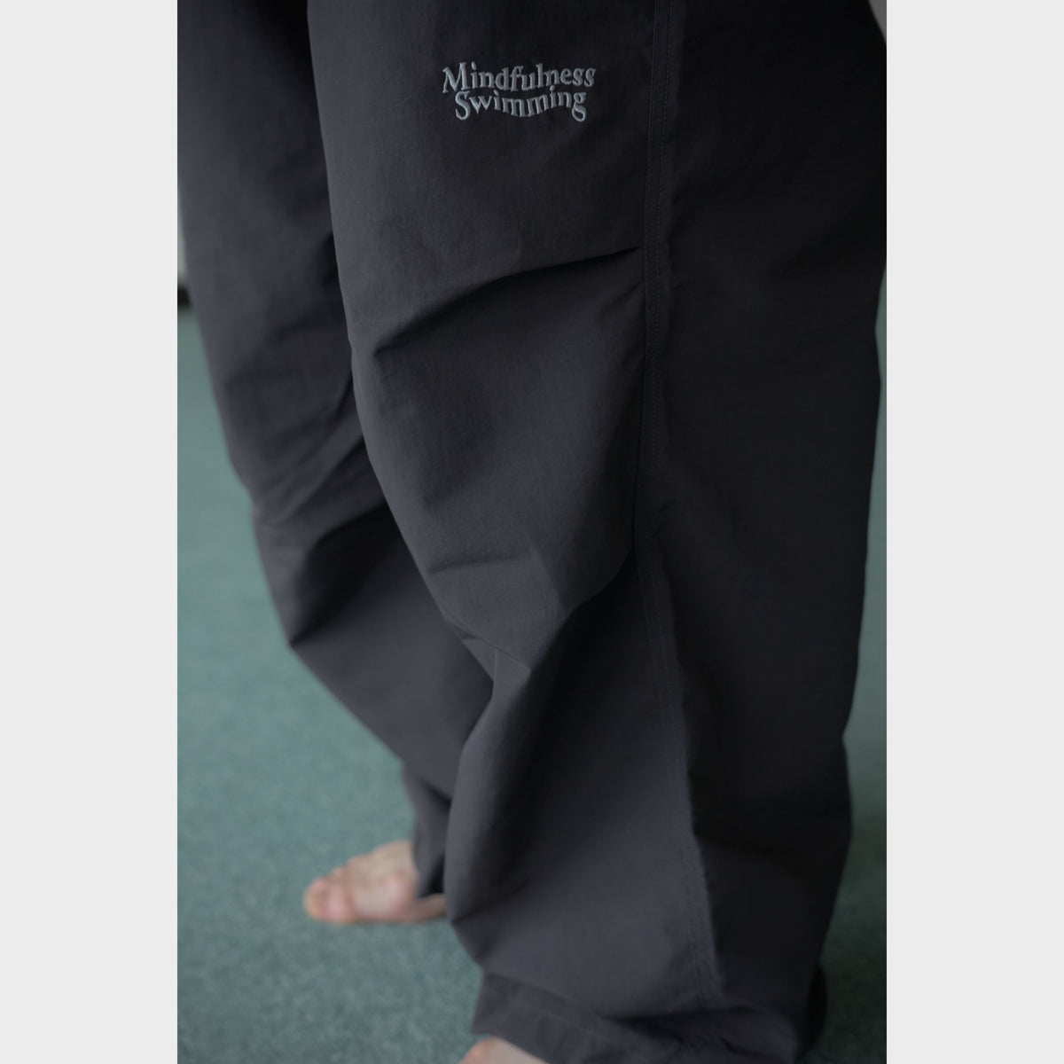 NYLON TRACK TROUSERS “MINDFULNESS SWIMMING” ー BLK